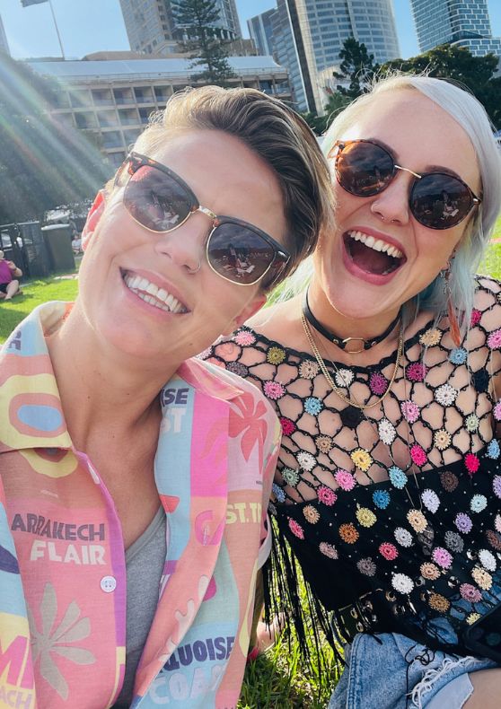 lesbian couple in colourful pride oufits